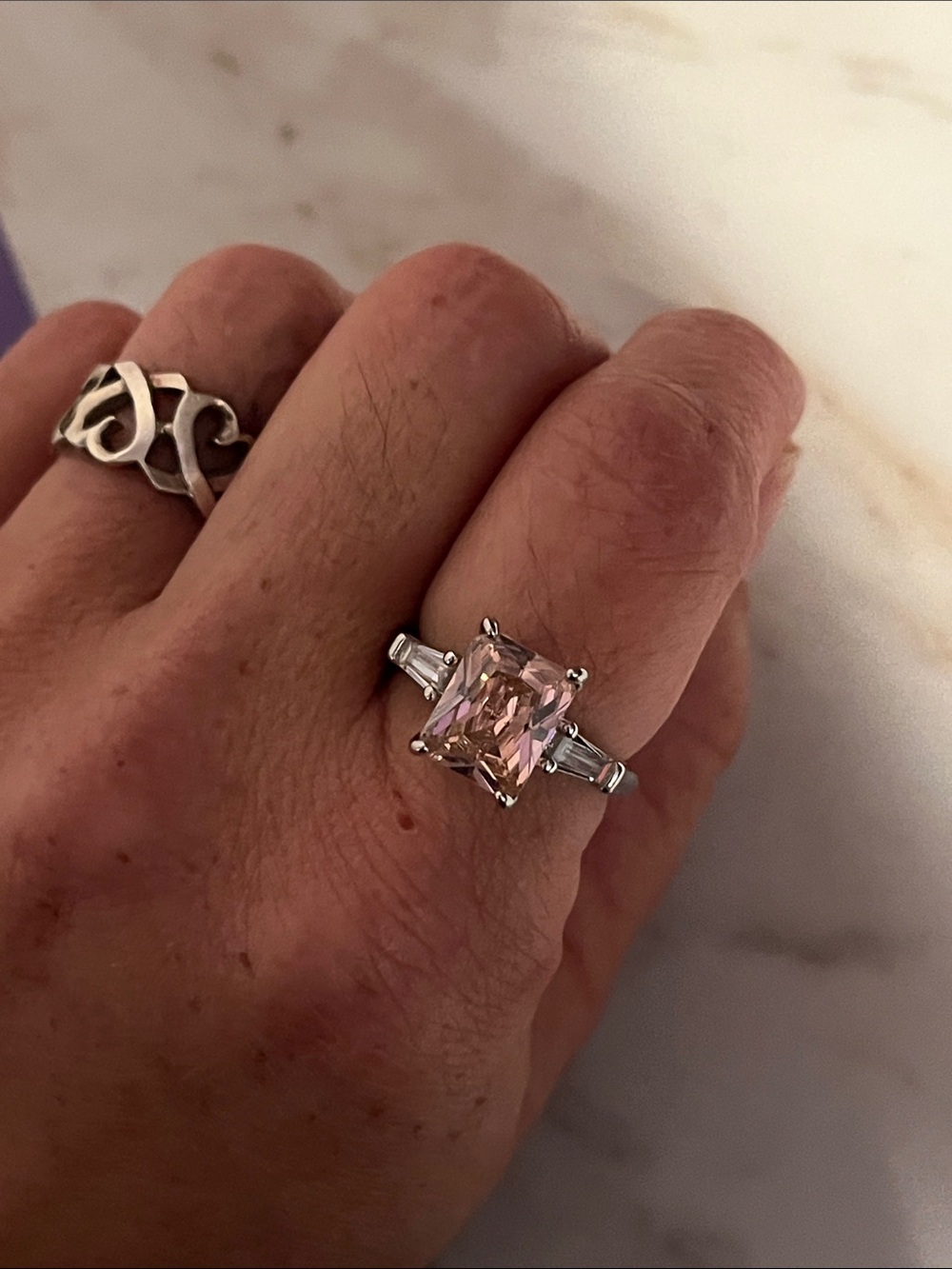Sparkling Pink Emerald-Cut Ring with Tapered Side Stones
